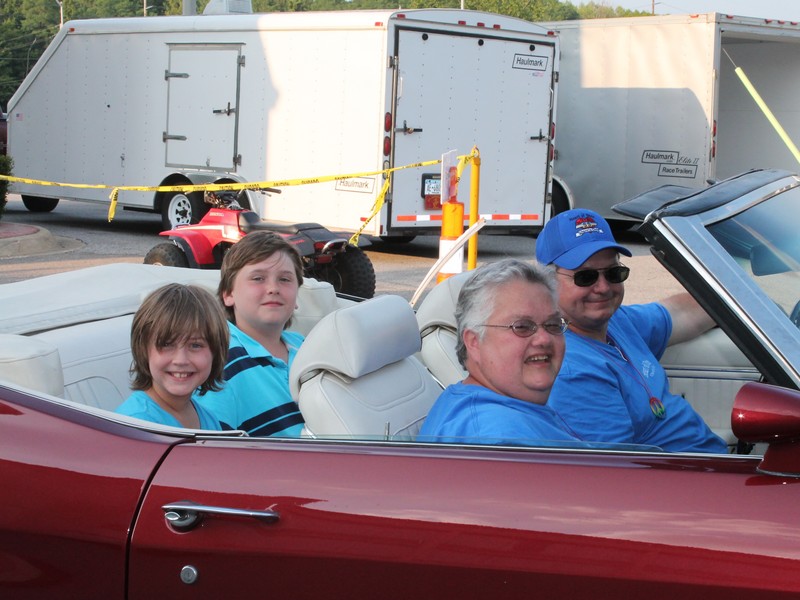 John (flash) and Joan in Joans 1972 Malibu Convertible. 
Who's that in the back seat ?  Looks like my kids, Leah and Jacob.