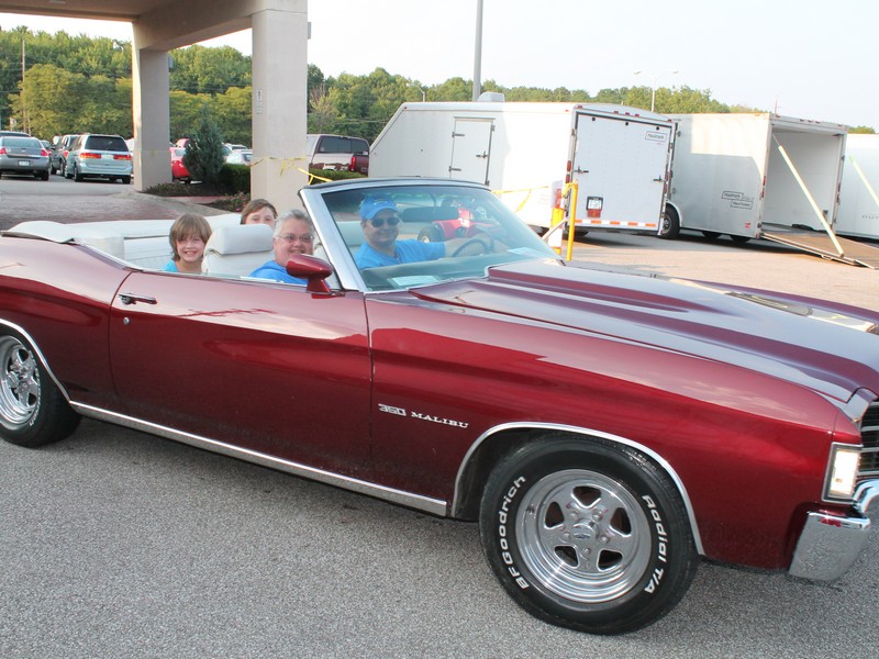 John (flash) and Joan in Joans 1972 Malibu Convertible. 
Who's that in the back seat ?  Looks like my kids, Leah and Jacob.