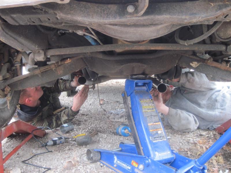 Cutting the exhaust to fit the new headers.